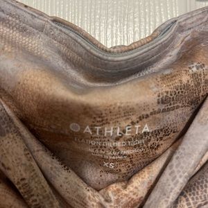 Athleta Elation Gilded tight. Size XS.  Colors are gold, cream and grey.